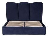 an image of a bed with a blue upholstered headboard and wooden slats