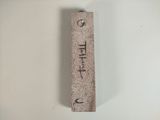 a stone keychain that has the word life written on it