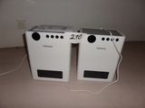 two speakers that are sitting next to each other on the floor