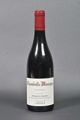 a bottle of wine that is sitting on a table
