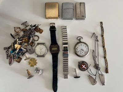 many different types of watches and other items on the table