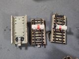 four miniature trains that are sitting on a table