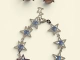 silver and blue star bracelet and earring set with swarovs