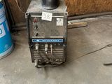 an image of a welding machine in a garage