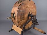 an old wooden barrel with a bunch of screws on top of it