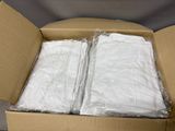 a cardboard box with two white shirts inside of it