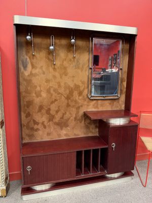 an image of a room with a mirror and a cabinet