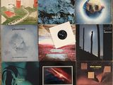 various album covers of various types and sizes on a table