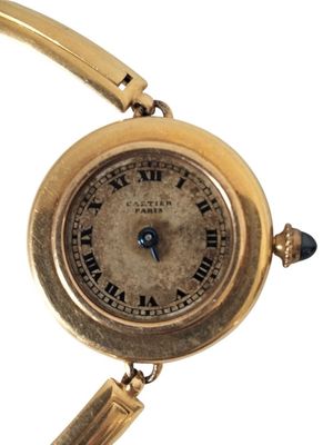 an image of a close up of a wrist watch with roman numerals