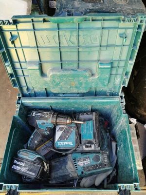 a green box with tools in it on a pallet