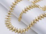 Bracelet à maillons en forme de pointes plaqué or jaune, orné de pierres CZ
