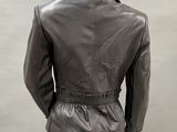a mannequin wearing a black leather jacket and skirt