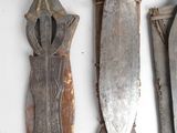 several different types of metal items are displayed on a white surface
