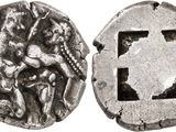 a silver coin with an image of a man and a woman on it
