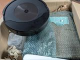 a box with a vacuum cleaner and other items in it