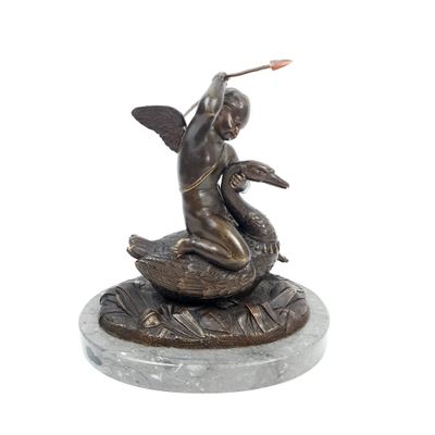statue of a woman sitting on top of a bird on a marble base