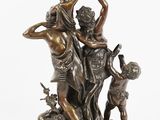 bronze statue of a woman and two children playing with a dog