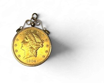 l'image d'une pièce d'or sur laquelle figure le visage d'une femme