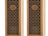a pair of wooden boxes with a design on them