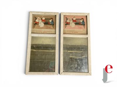 two mirrors that are sitting on the wall