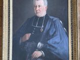 portrait of a man in a priest ' s robes holding a book