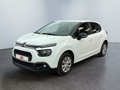 a white citrole is parked in a white room