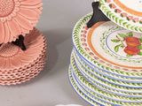 many plates stacked on top of each other on a table