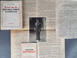 several old french newspapers are stacked on top of each other on a table