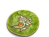an image of a green plate with a flower on it