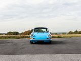 a blue car that is parked on the side of the road