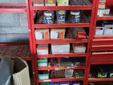 a red shelving with lots of items on it
