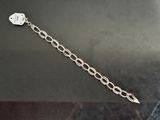 a close up of a metal chain with a tag on it