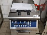 an image of a commercial kitchen with stainless steel appliances