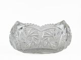 a clear glass bowl with a decorative design on it
