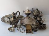 a lot of silver items that are on a table