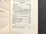 an open book on a table with a list of things on it