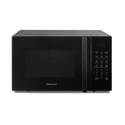 un four à micro-ondes noir posé sur un comptoir blanc