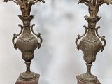 two vases that are sitting on top of a table
