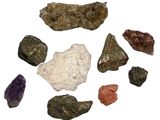 many different colored rocks on a white surface