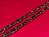 two chains on a red surface with a red background