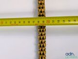 a measuring tape on the side of a wooden cross