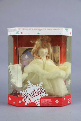 doll in a box with a snowflake on top of it