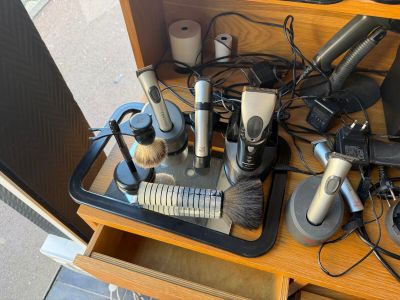 many different types of hair dryers and brushes on a table