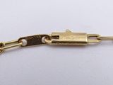 an image of a close up of a chain on a white surface