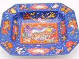 a blue bowl with a picture of a horse on it