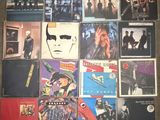 the album covers of various albums are displayed on the floor