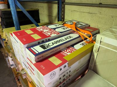 a stack of books sitting on a pallet in a warehouse