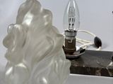 a lamp that is sitting on a table next to a lamp