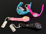 three wrist watches with tags attached to them on a table