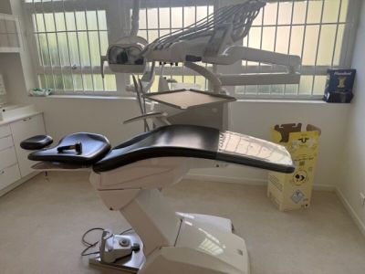 an image of a dentist ' s chair in a room